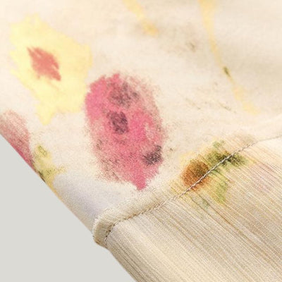 Delilah - plisseret midi-nederdel med blomsterprint i pastelfarver