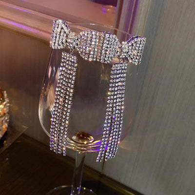 Selena - glamourøse krystal sløjfeøreringe med kvastdesign