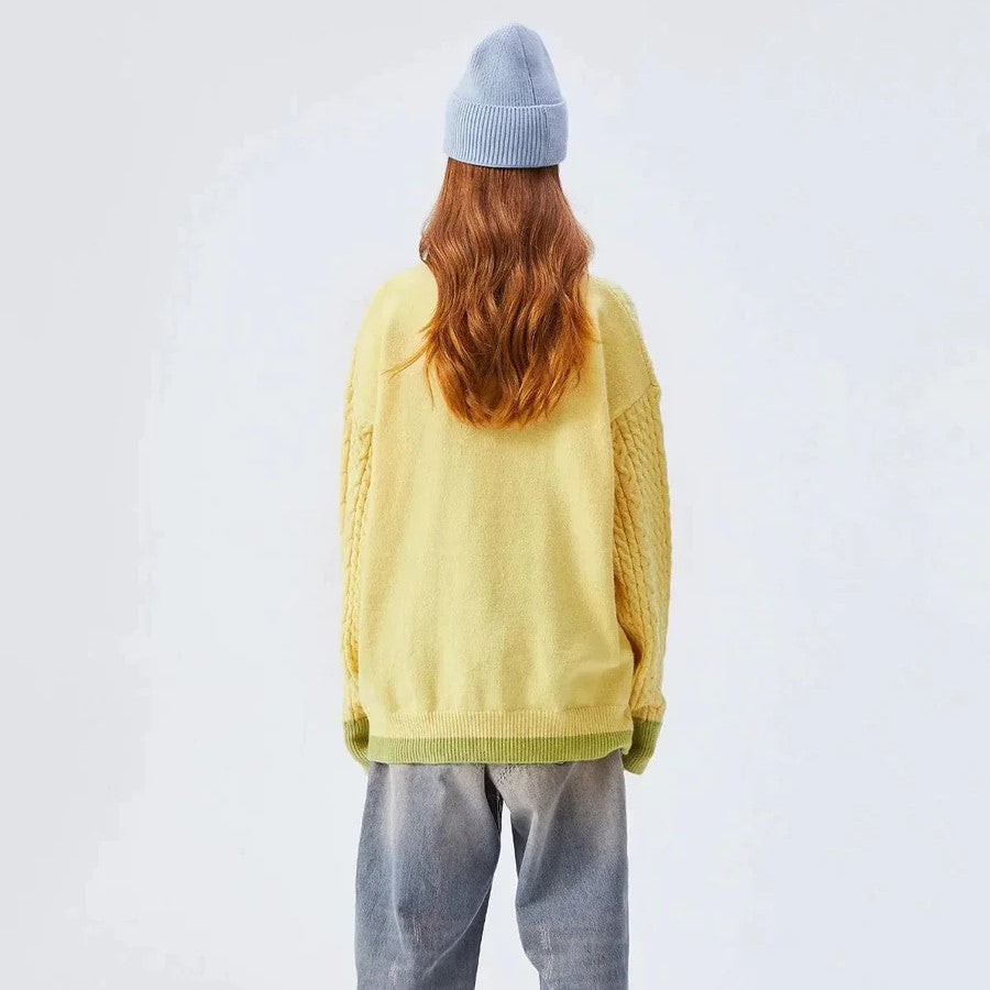 Sabrina - kabelstrikket sweater med pastelsky motiv